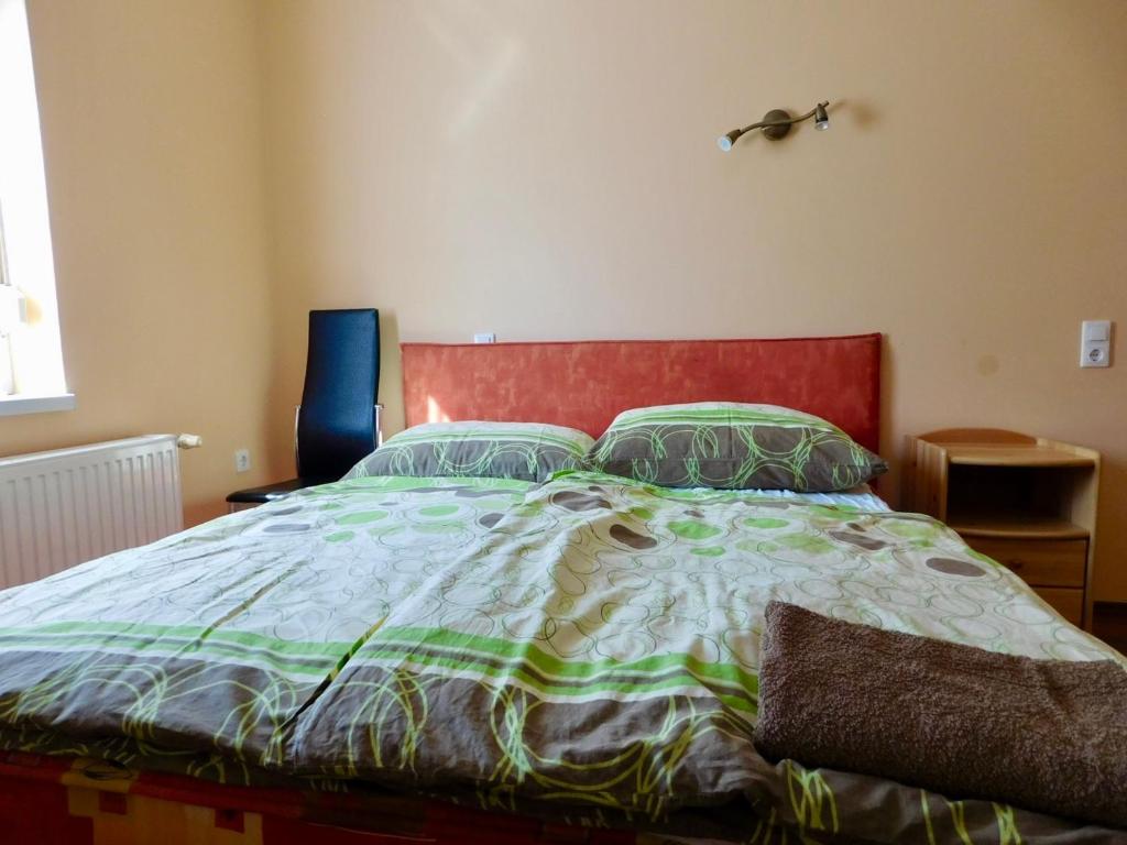 Postel nebo postele na pokoji v ubytování Csetáj Vendégház