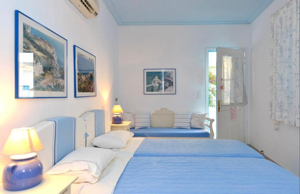 Postel nebo postele na pokoji v ubytování Anthousa Hotel