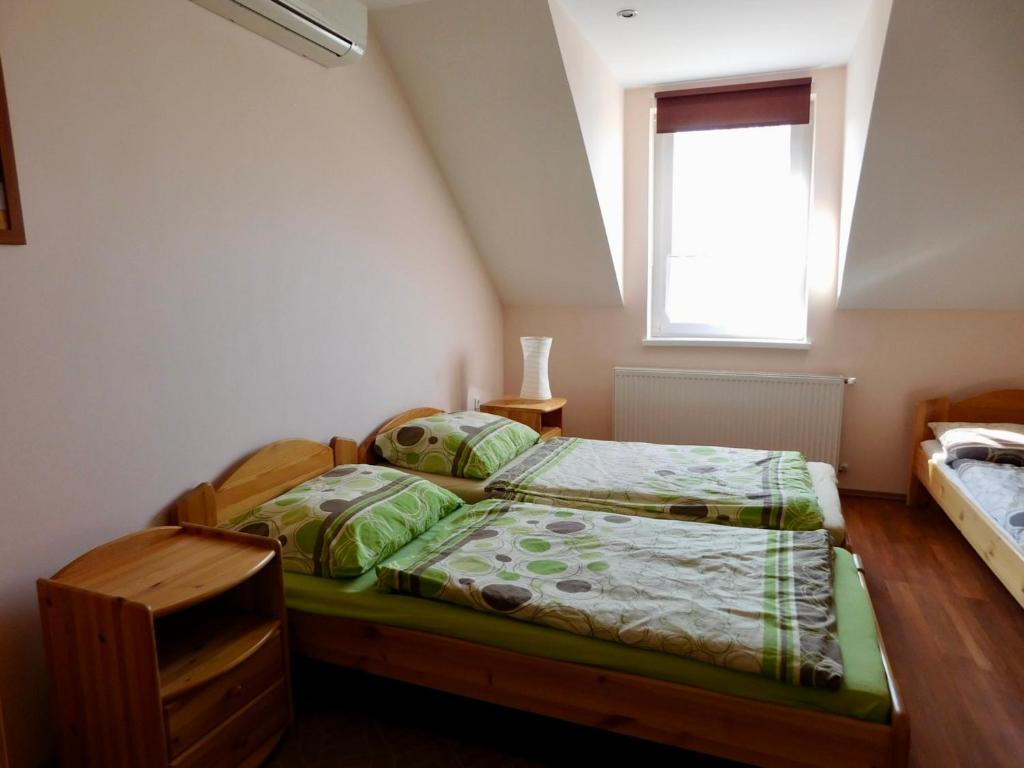Postel nebo postele na pokoji v ubytování Csetáj Vendégház