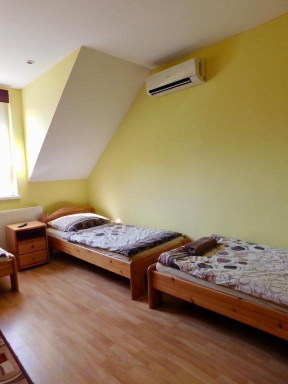 Postel nebo postele na pokoji v ubytování Csetáj Vendégház