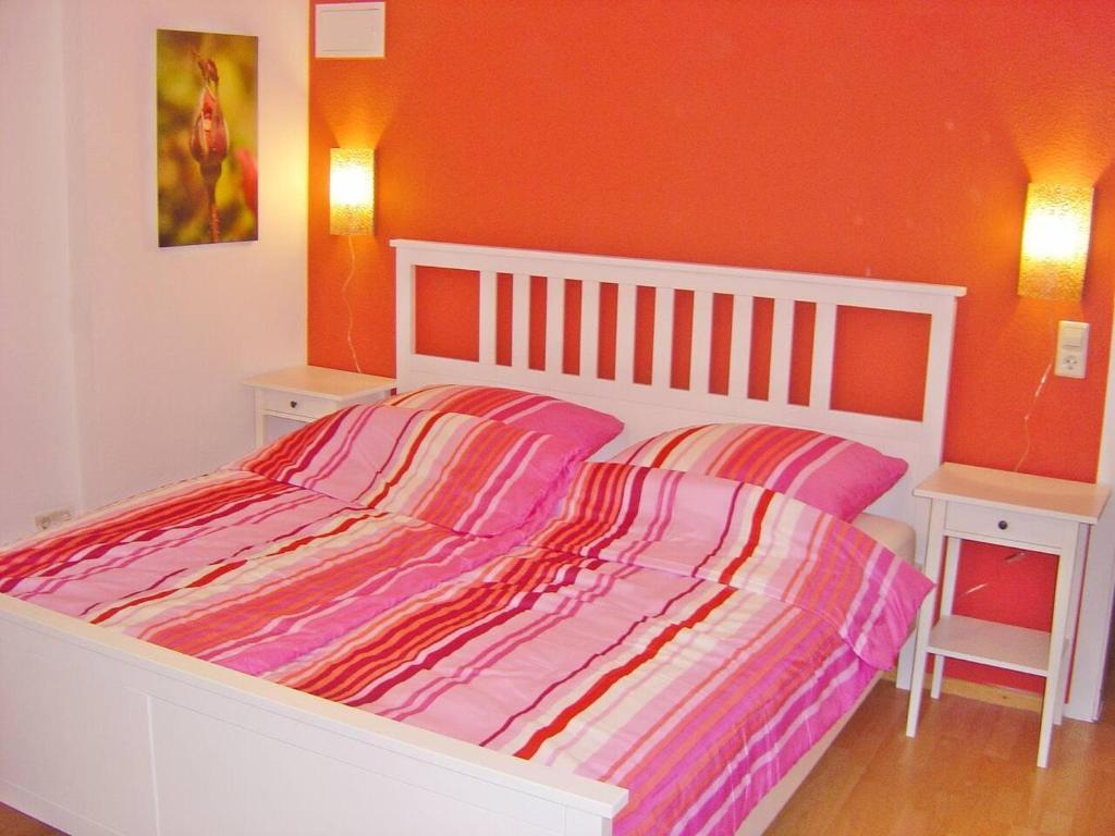a bedroom with a bed and two night stands at 2 Bed Apt Sleeps 5 - Rooftop Terrace Wifi in Cochem