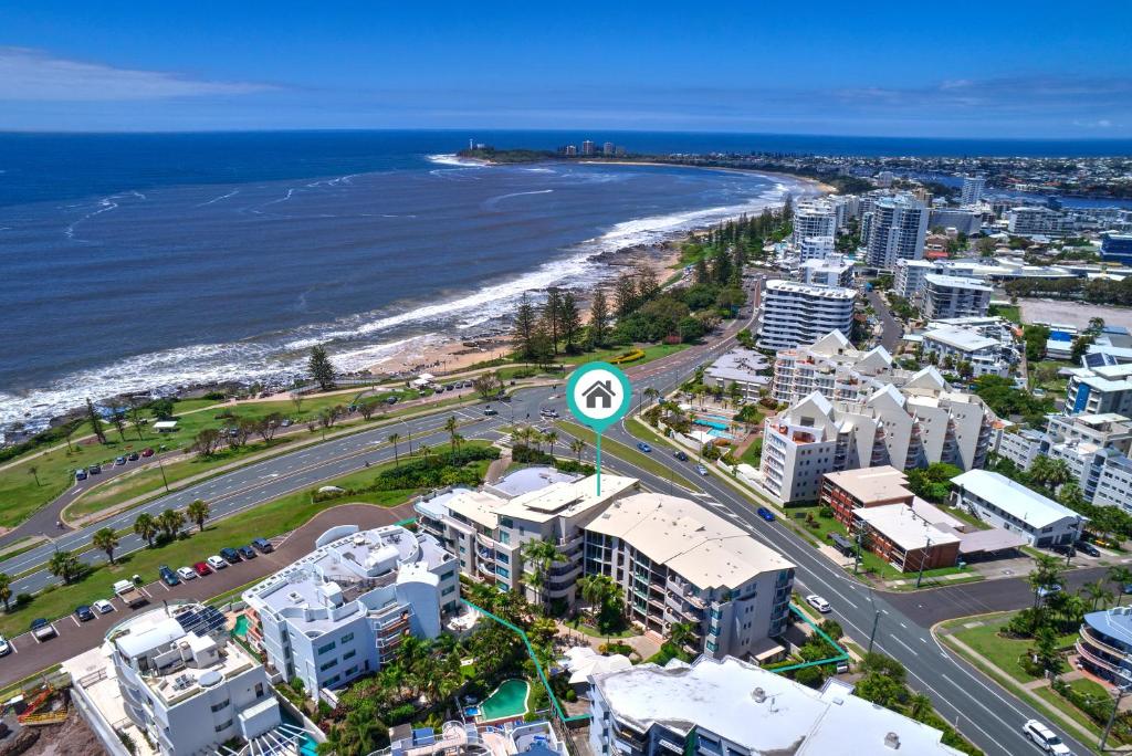 an aerial view of a city and the beach at Alexandra on the Pacific in Mooloolaba