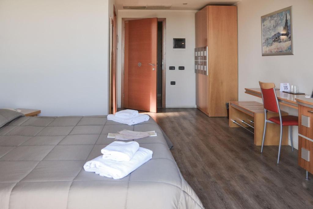Postel nebo postele na pokoji v ubytování Planet Hotel