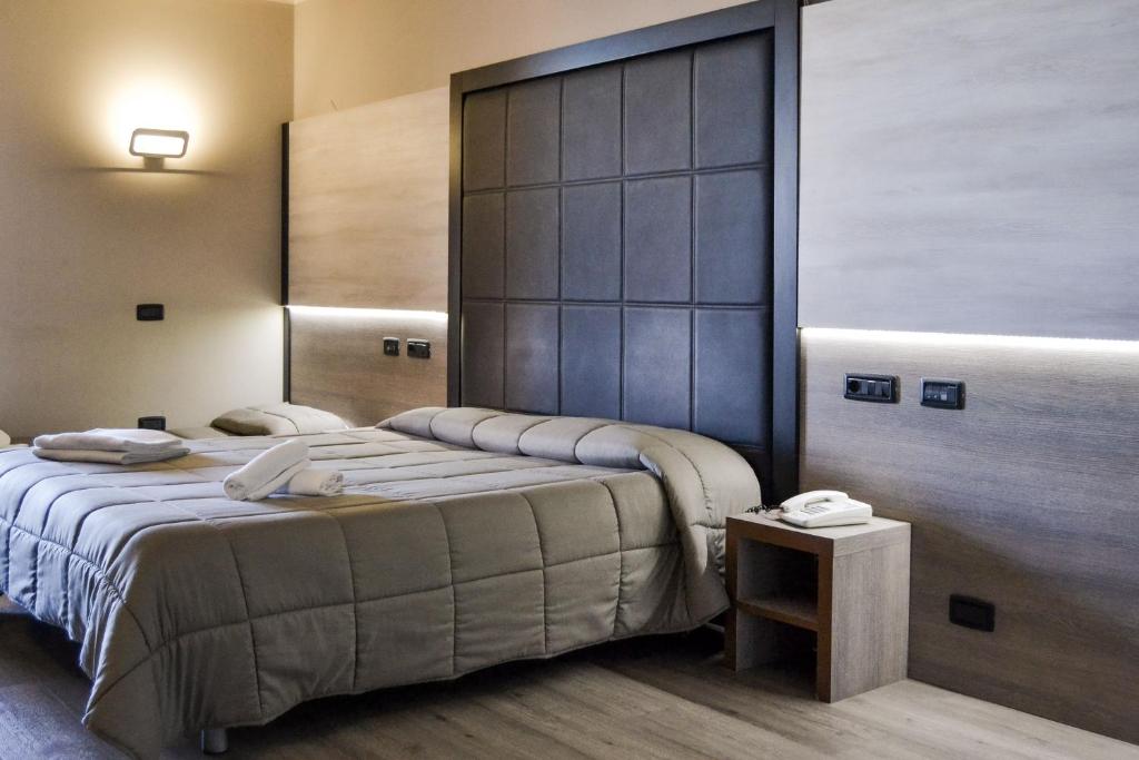 Postel nebo postele na pokoji v ubytování Planet Hotel