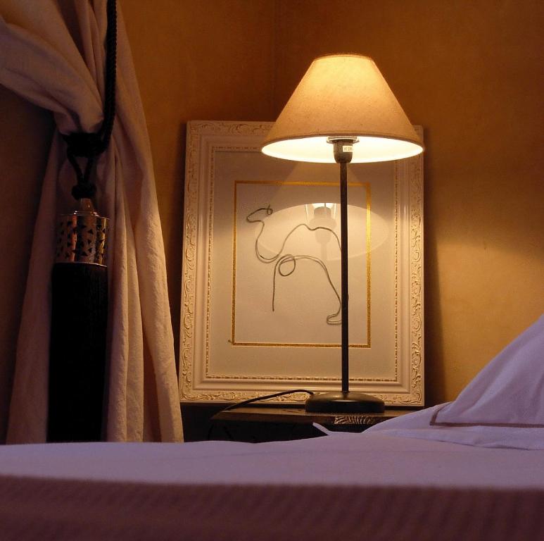 Postel nebo postele na pokoji v ubytování Riad Aderbaz