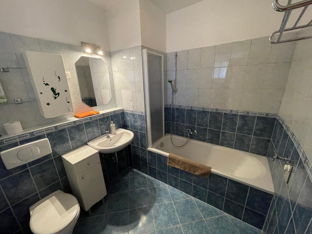 Koupelna v ubytování Club218 Holiday Apartman Siófok