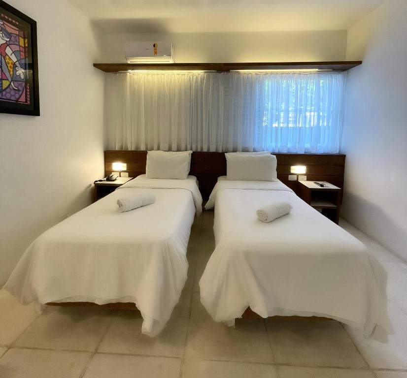 Posteľ alebo postele v izbe v ubytovaní Delphin Beach Hotel