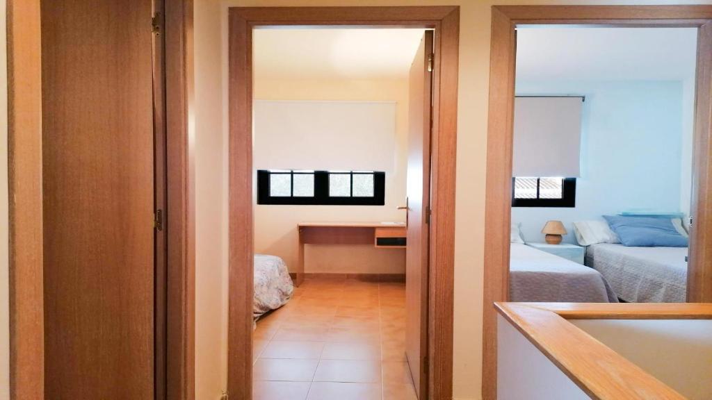 Posteľ alebo postele v izbe v ubytovaní VACAY Dúplex Gala, jardín, aire libre, sol, en la Costa Brava, L'Escala!