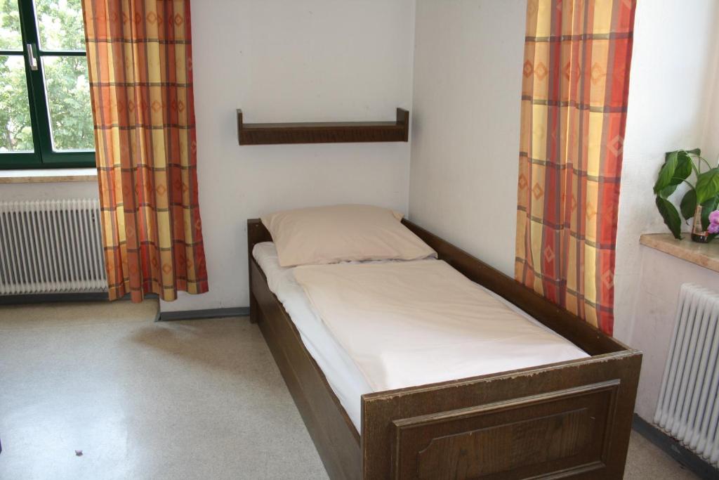 Postel nebo postele na pokoji v ubytování DORMitory