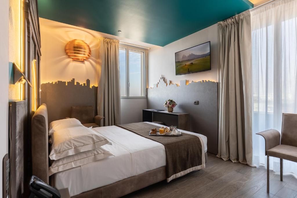 Postel nebo postele na pokoji v ubytování Hotel Ariston