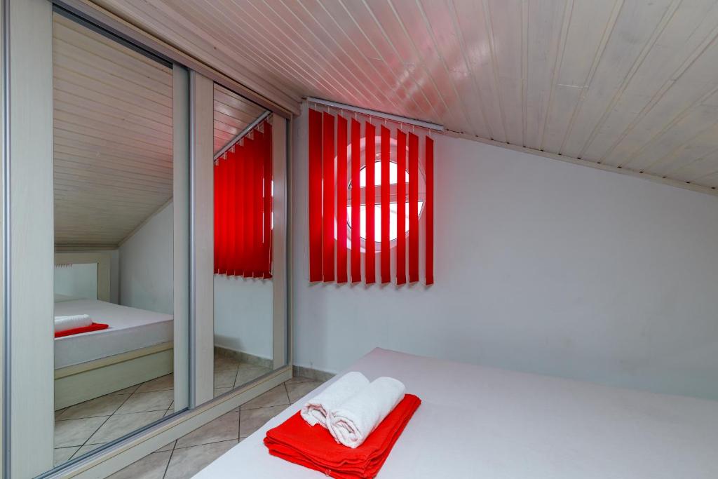 Łóżko lub łóżka w pokoju w obiekcie Apartments DIDO
