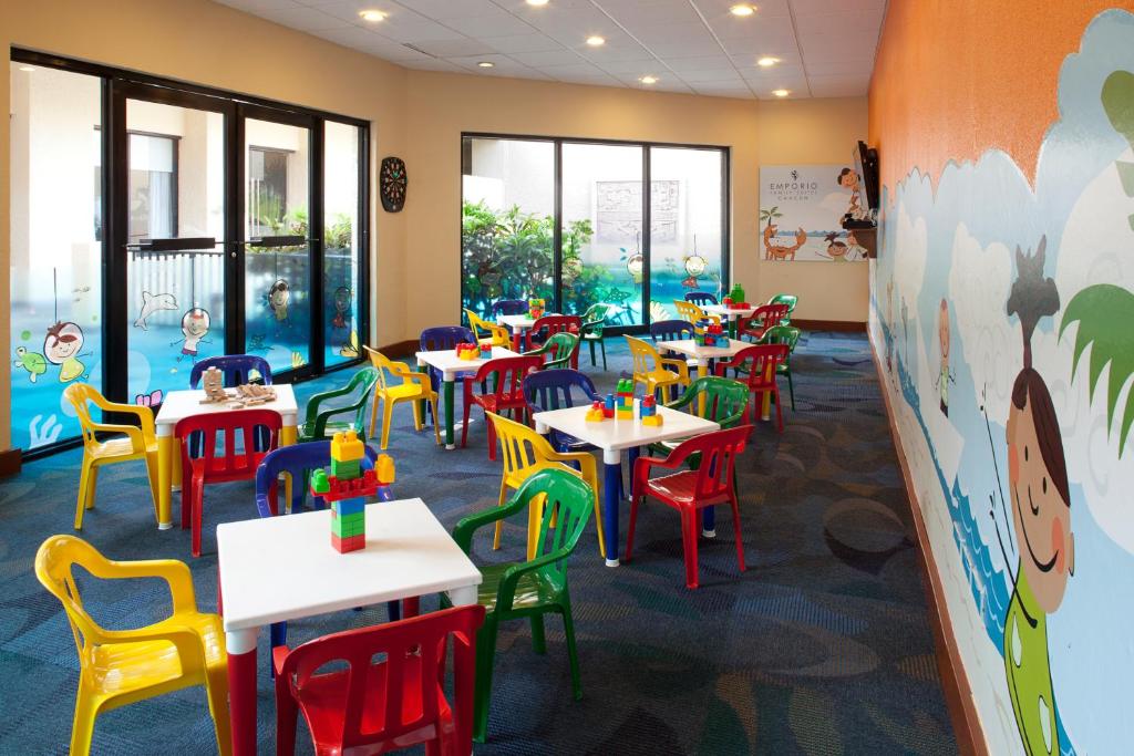 a classroom with tables and chairs in a school cafeteria at Emporio Cancun - Buy All Inclusive Option in Cancún
