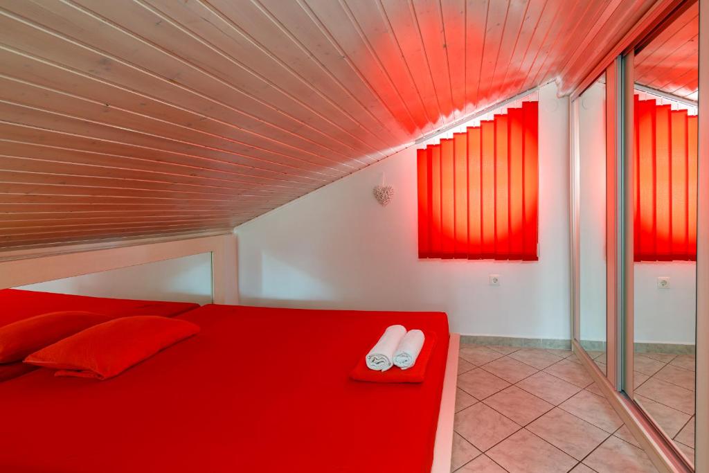 Łóżko lub łóżka w pokoju w obiekcie Apartments DIDO