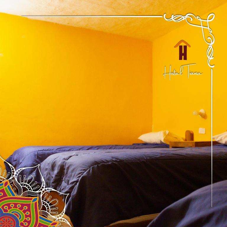 Postel nebo postele na pokoji v ubytování Hostal Café Tiana