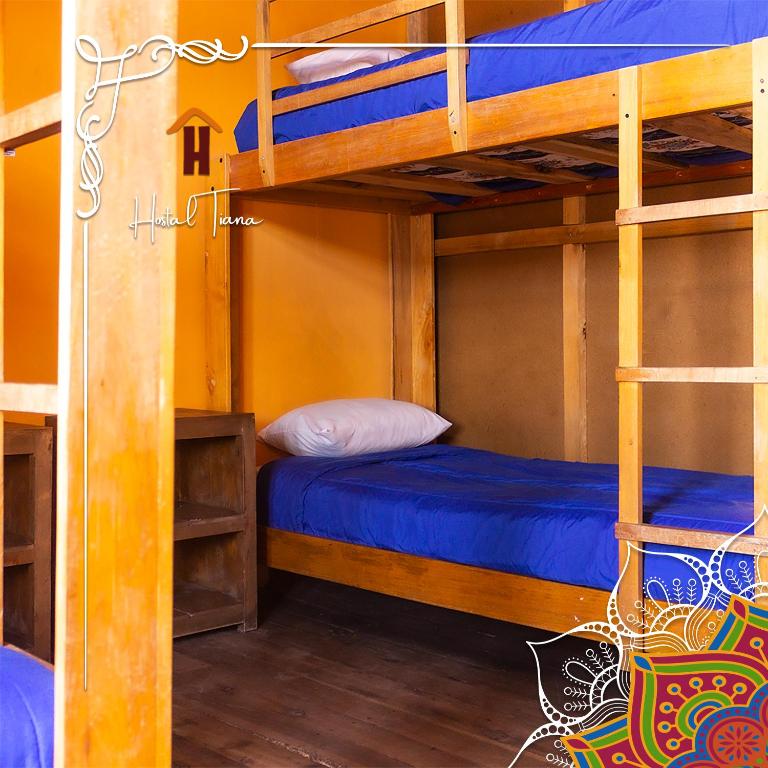 Postel nebo postele na pokoji v ubytování Hostal Café Tiana