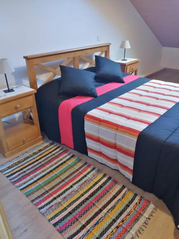 Postel nebo postele na pokoji v ubytování Recantos do Castanheiro