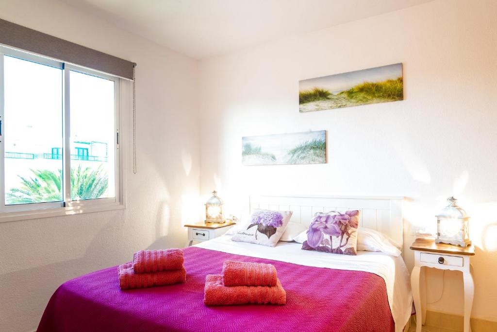A bed or beds in a room at Attico Estrella