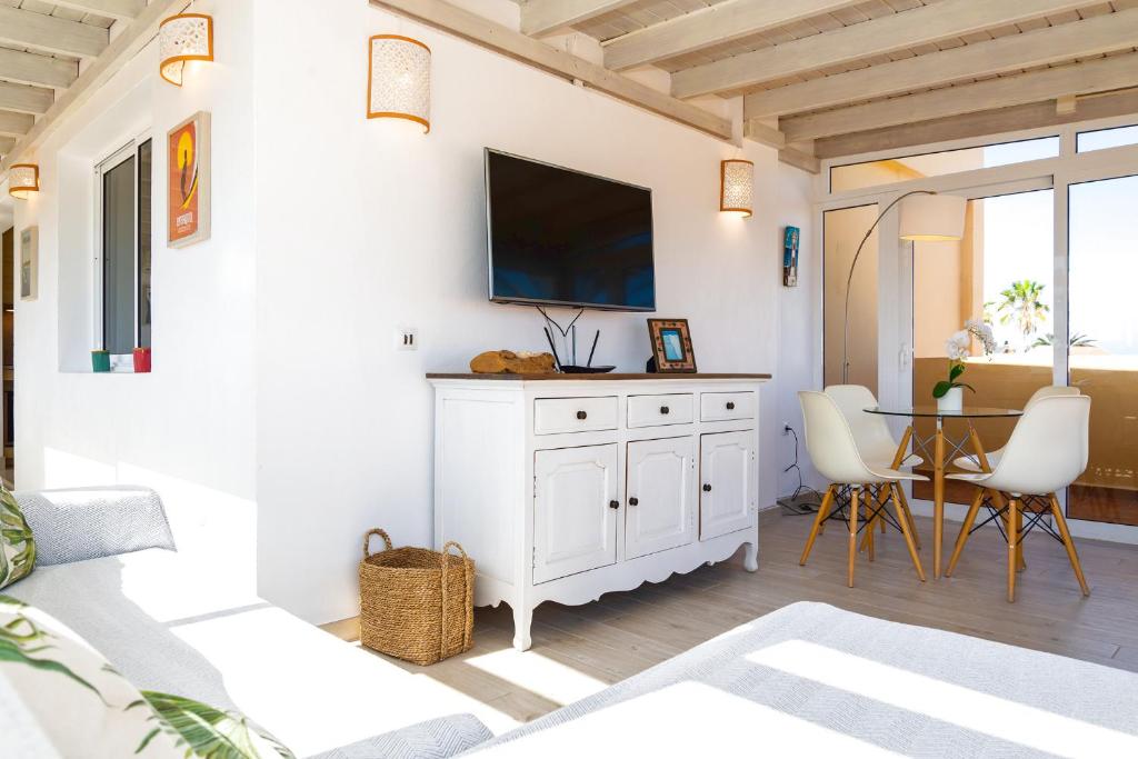 A television and/or entertainment centre at Attico Estrella