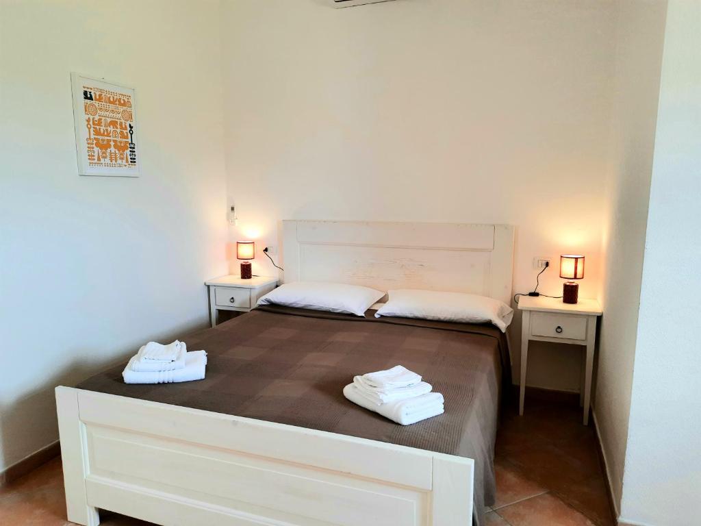 Postel nebo postele na pokoji v ubytování Agriturismo Orvile