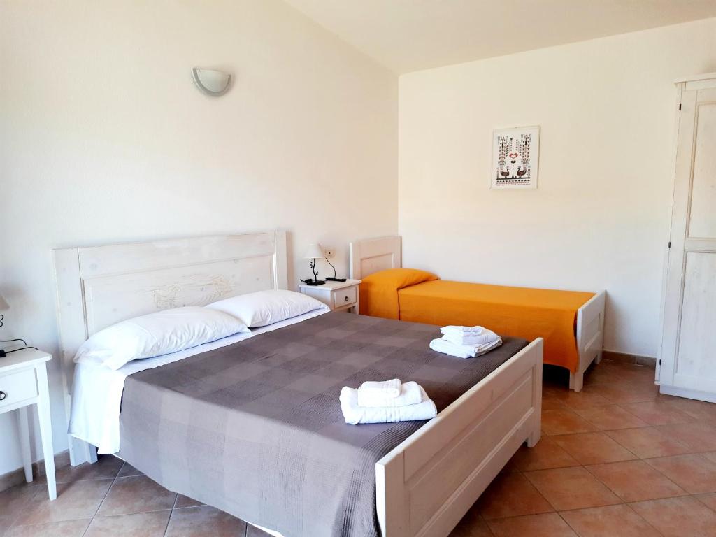 Postel nebo postele na pokoji v ubytování Agriturismo Orvile