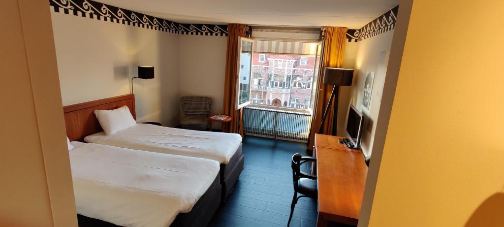 Postel nebo postele na pokoji v ubytování Hotel Theater Figi