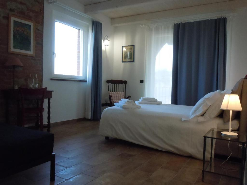 Postel nebo postele na pokoji v ubytování Antica Cascina Pilo