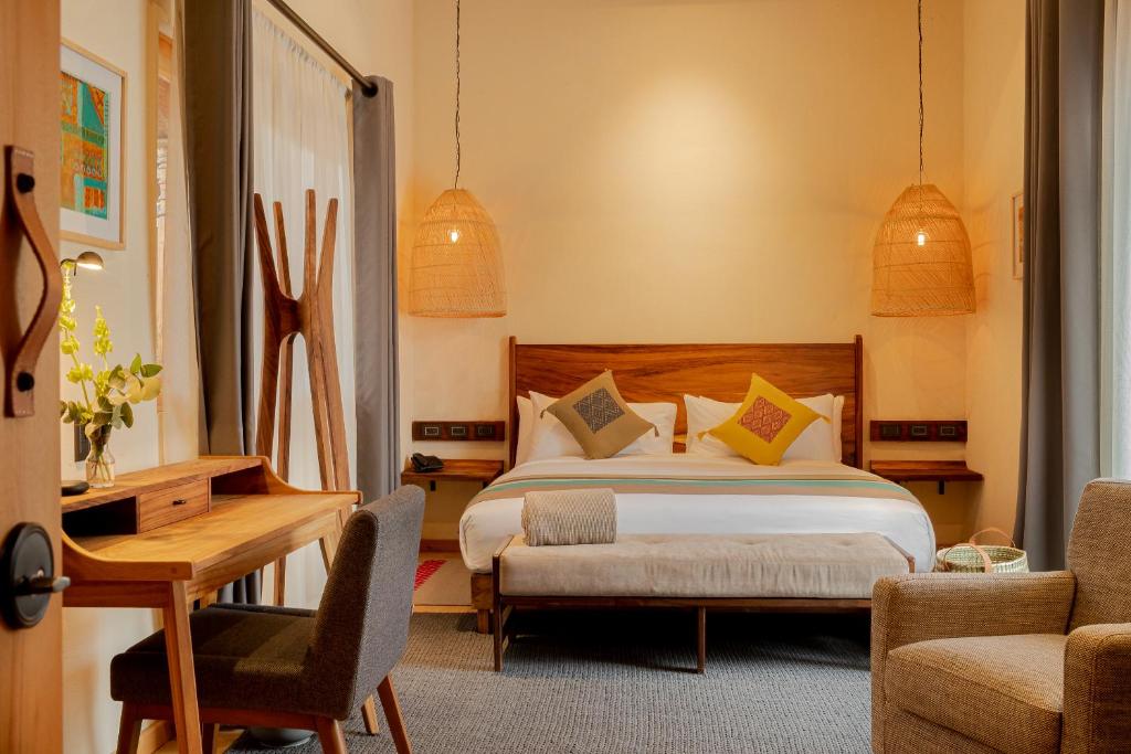 Postel nebo postele na pokoji v ubytování Taller de Juan - Casa Hotel