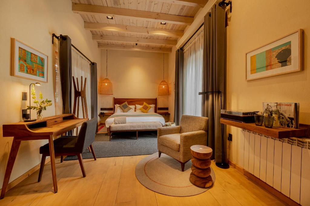 Postel nebo postele na pokoji v ubytování Taller de Juan - Casa Hotel