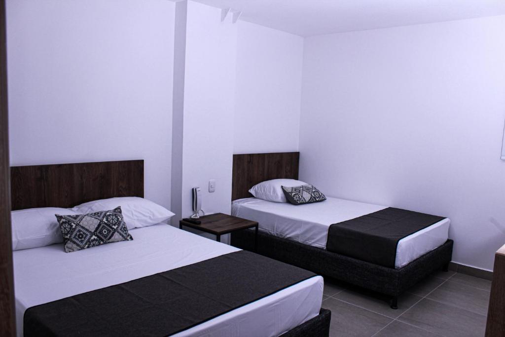 Postel nebo postele na pokoji v ubytování Ayenda Hotel MM