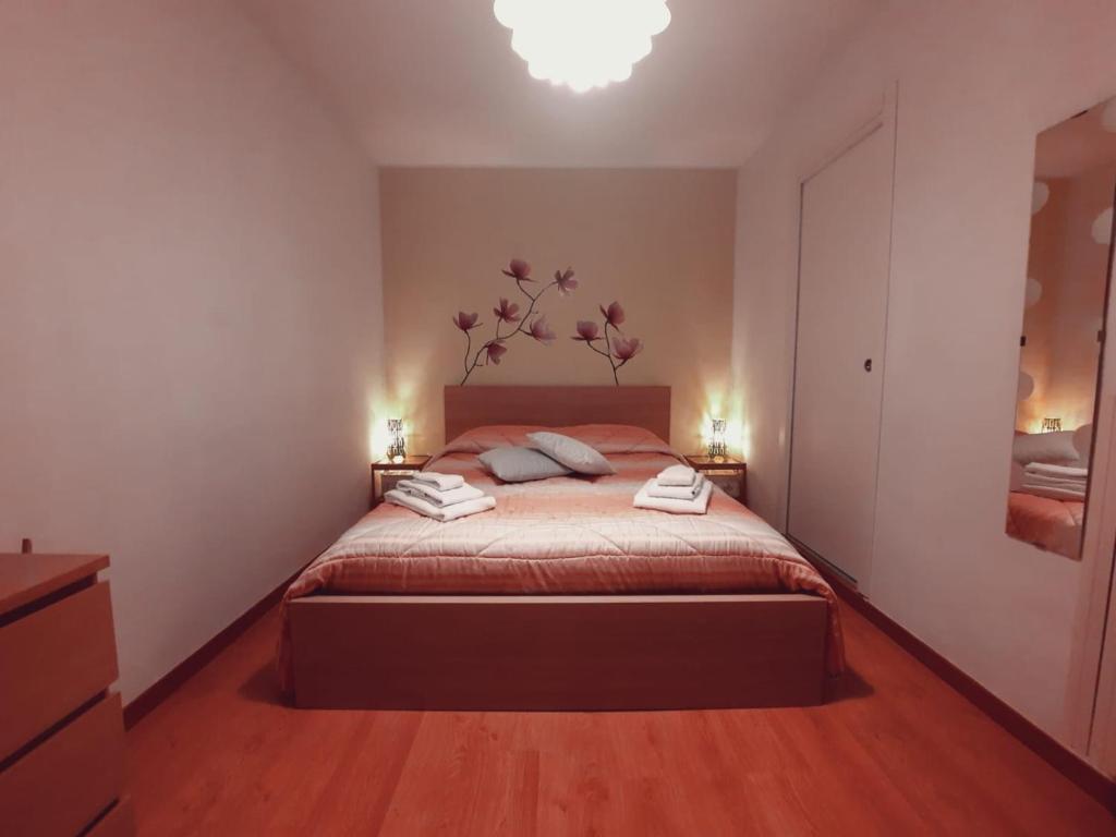 a bedroom with a bed with two pillows on it at Relax Home in Bari