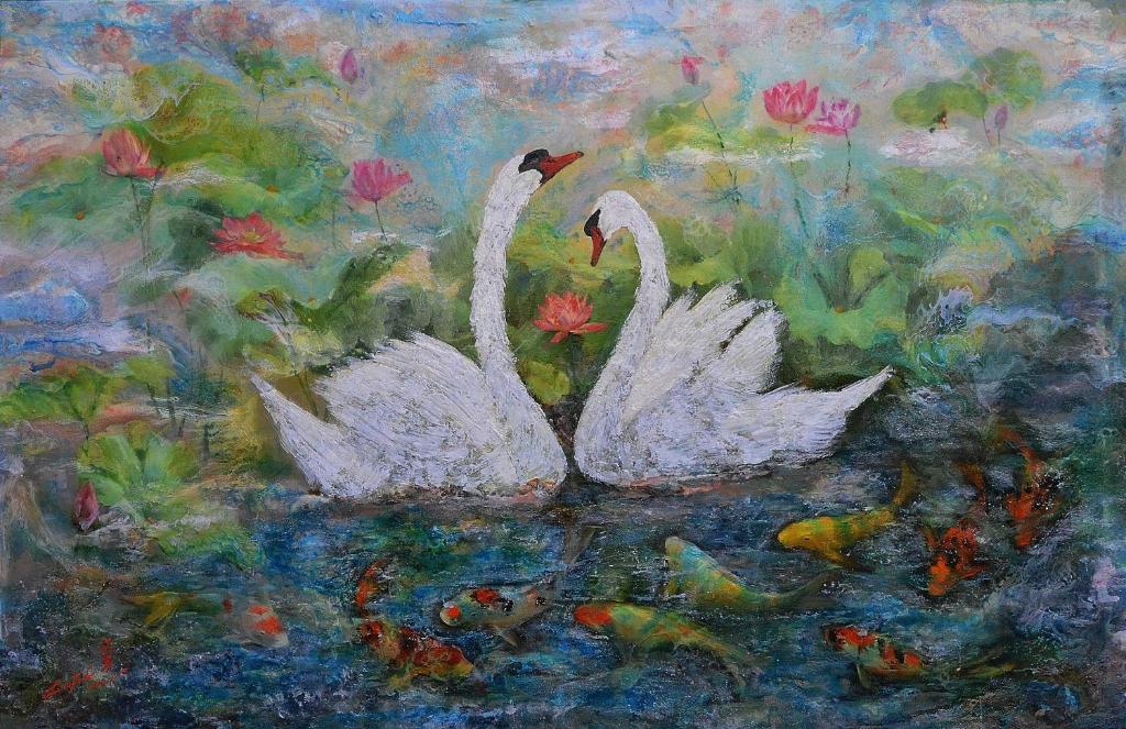 two white swans in a pond with fishes at Swan Lake Villa Resort in Nanwan