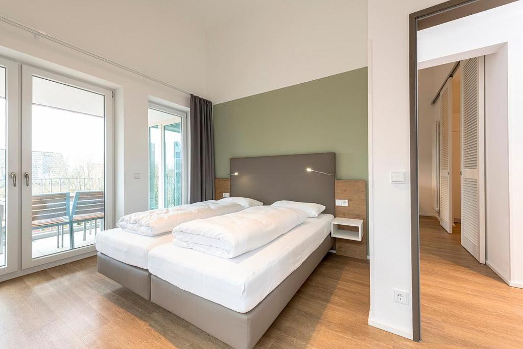 Postel nebo postele na pokoji v ubytování Apartmentvilla Anna See Apartmentvilla Anna See 3-01