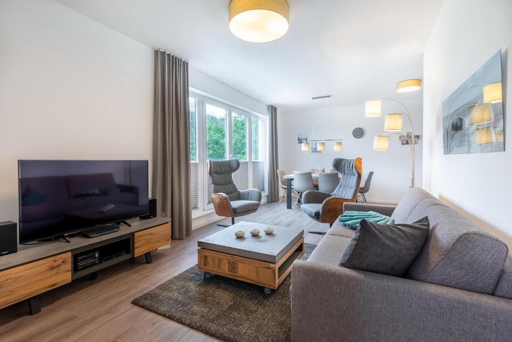 TV a/nebo společenská místnost v ubytování Aparthotel Ostseeallee Aparthotel Ostseeallee 3-27