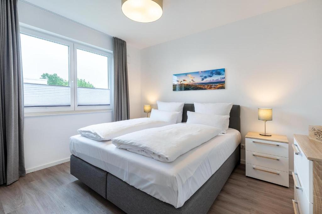 Postel nebo postele na pokoji v ubytování Aparthotel Ostseeallee Aparthotel Ostseeallee 3-27