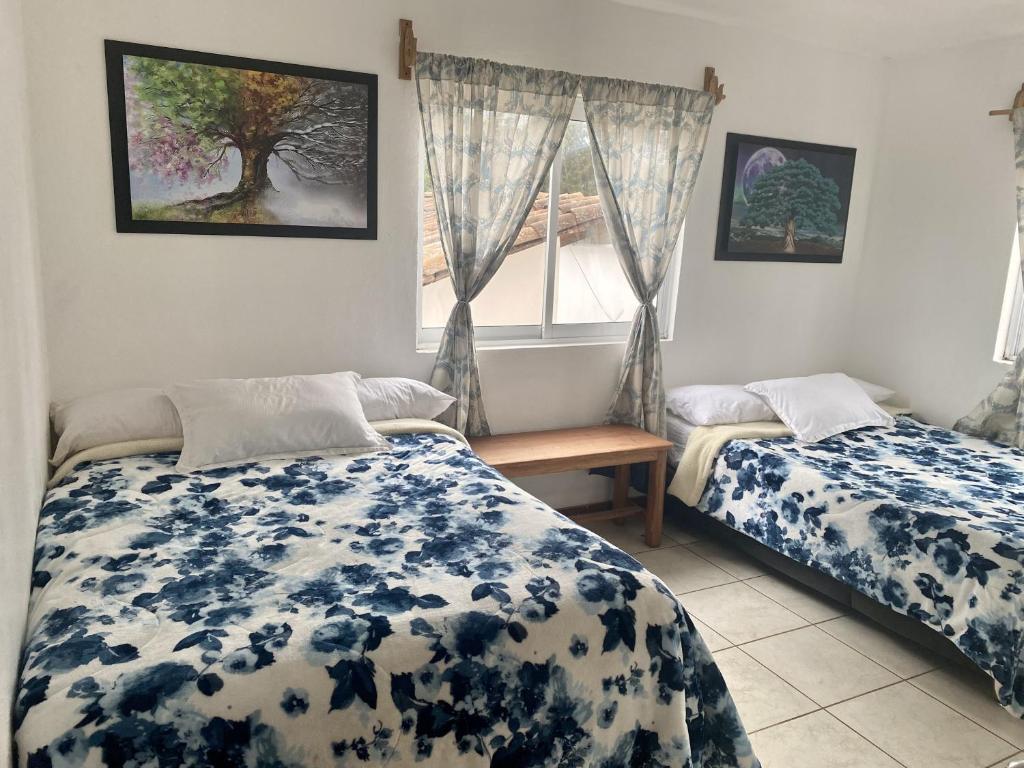 Postel nebo postele na pokoji v ubytování Herradura VIP Inn