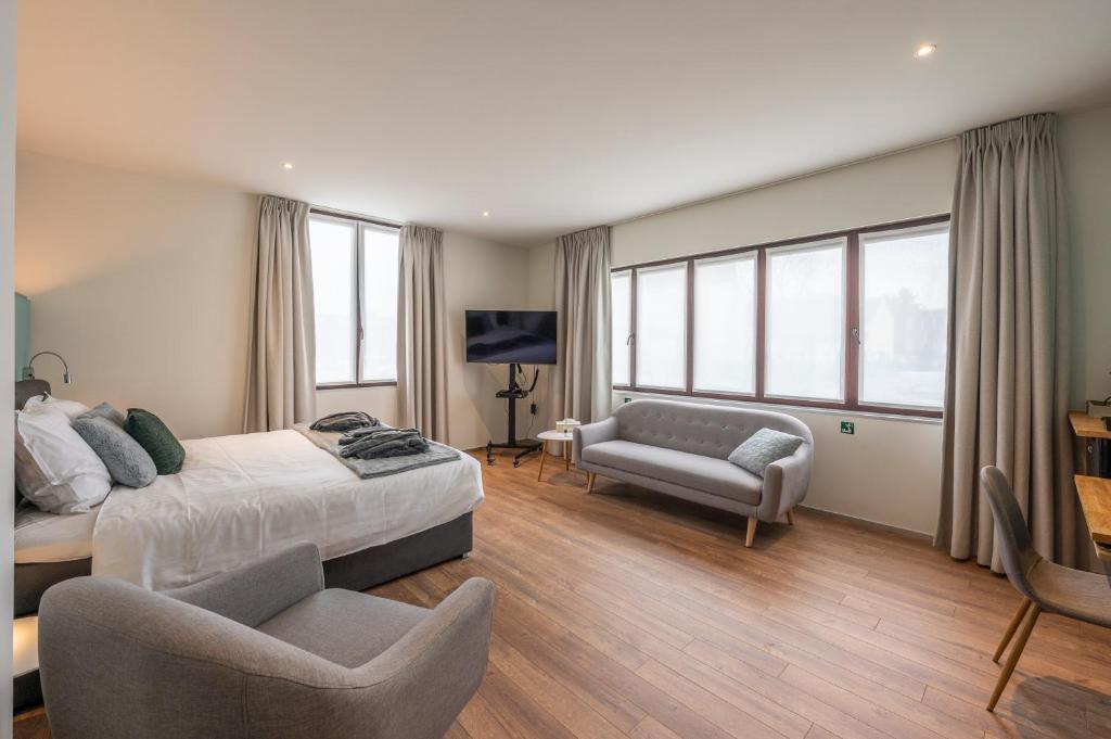 Postel nebo postele na pokoji v ubytování Hotel Fi'Lin
