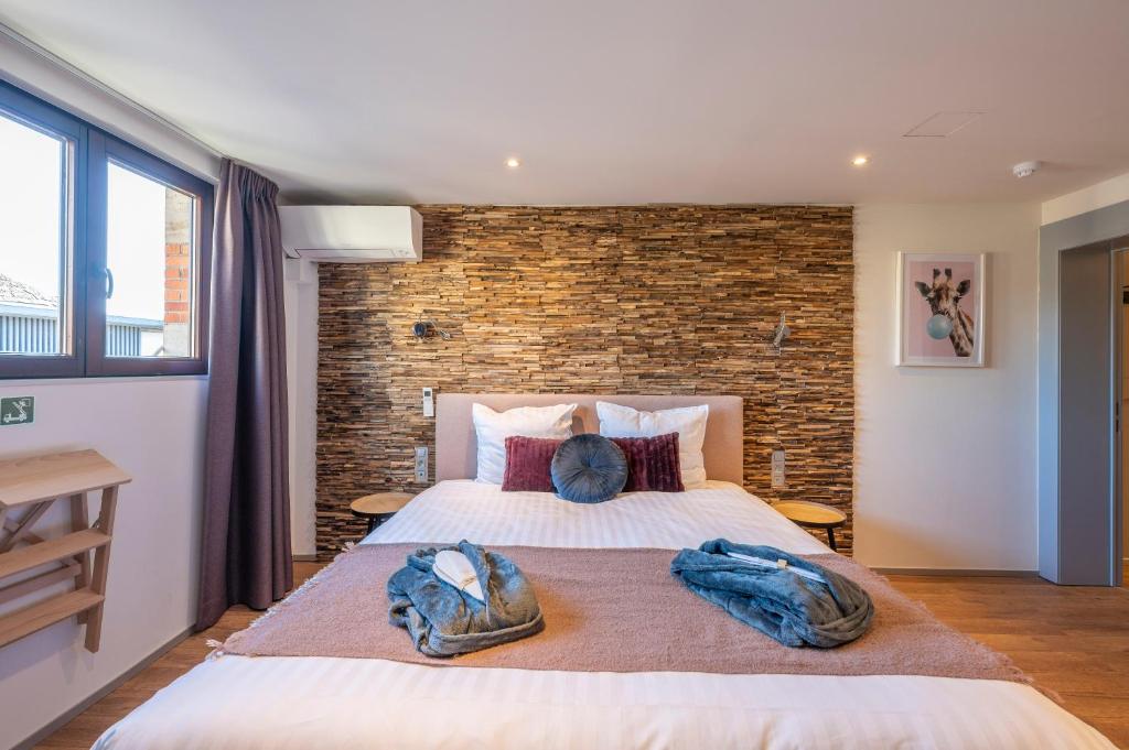 Postel nebo postele na pokoji v ubytování Hotel Fi'Lin