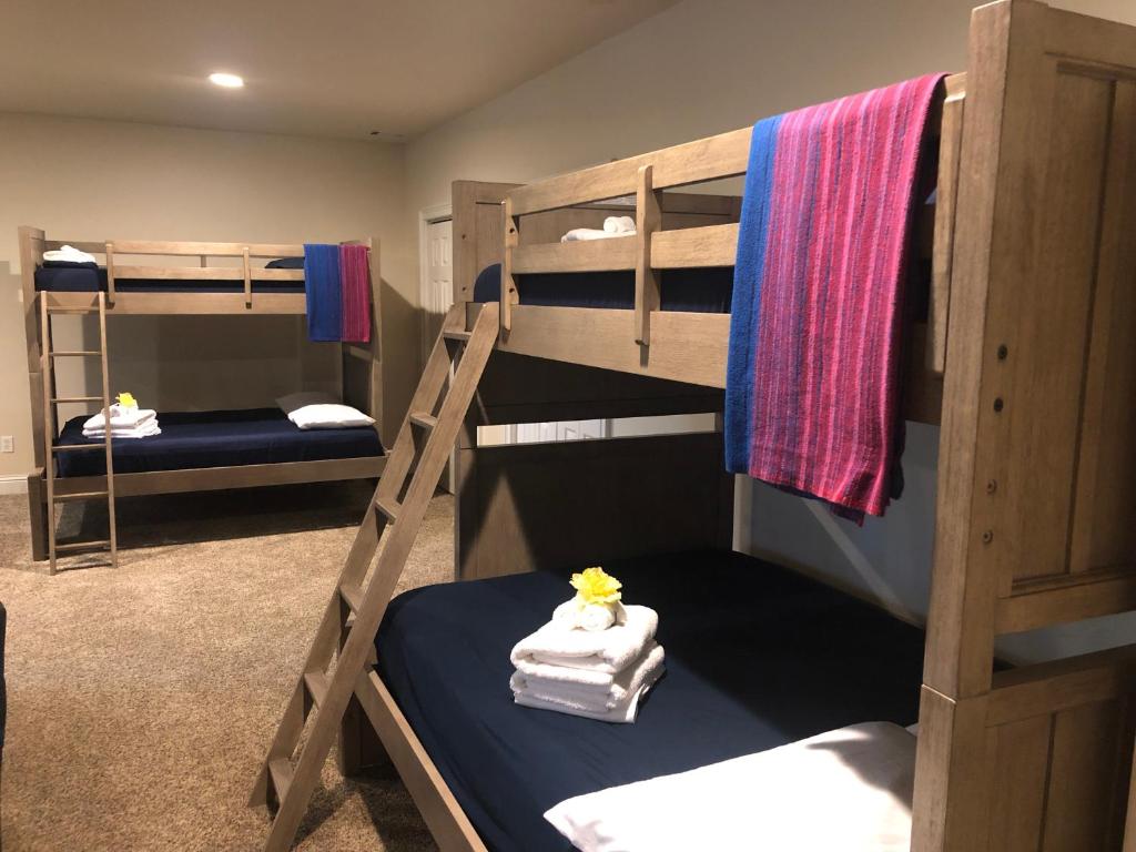 a room with two bunk beds and a room with at Lake views galore from balconies right on the lake and drought-proof deep water in Murrayville