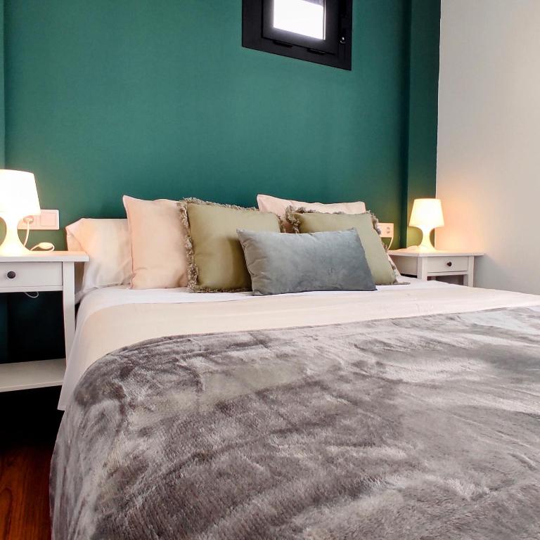 Posteľ alebo postele v izbe v ubytovaní Apartamentos LOS GATA GATA