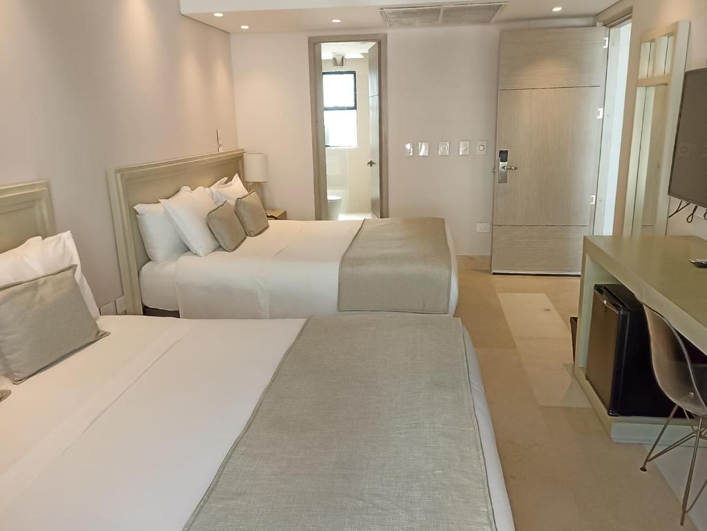 Postel nebo postele na pokoji v ubytování Hotel Boutique Maree
