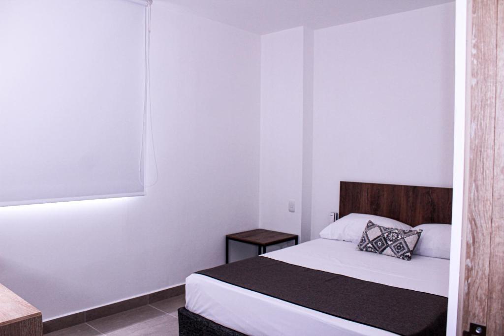 Postel nebo postele na pokoji v ubytování Ayenda Hotel MM