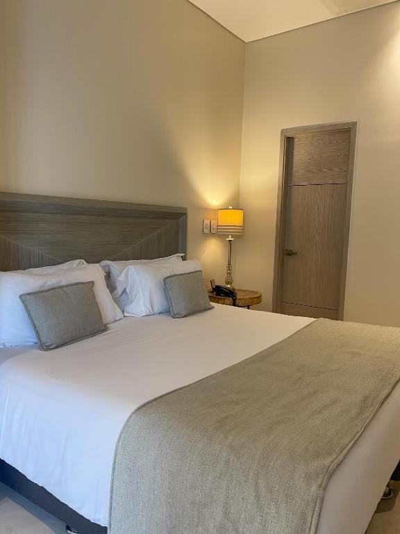 Postel nebo postele na pokoji v ubytování Hotel Boutique Maree