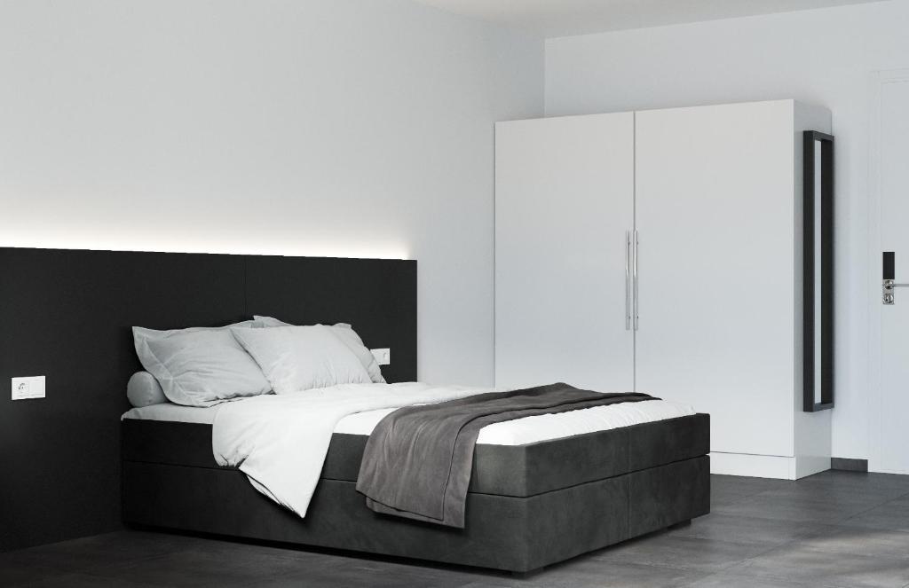Postel nebo postele na pokoji v ubytování The Residences - Apartments Frankfurt