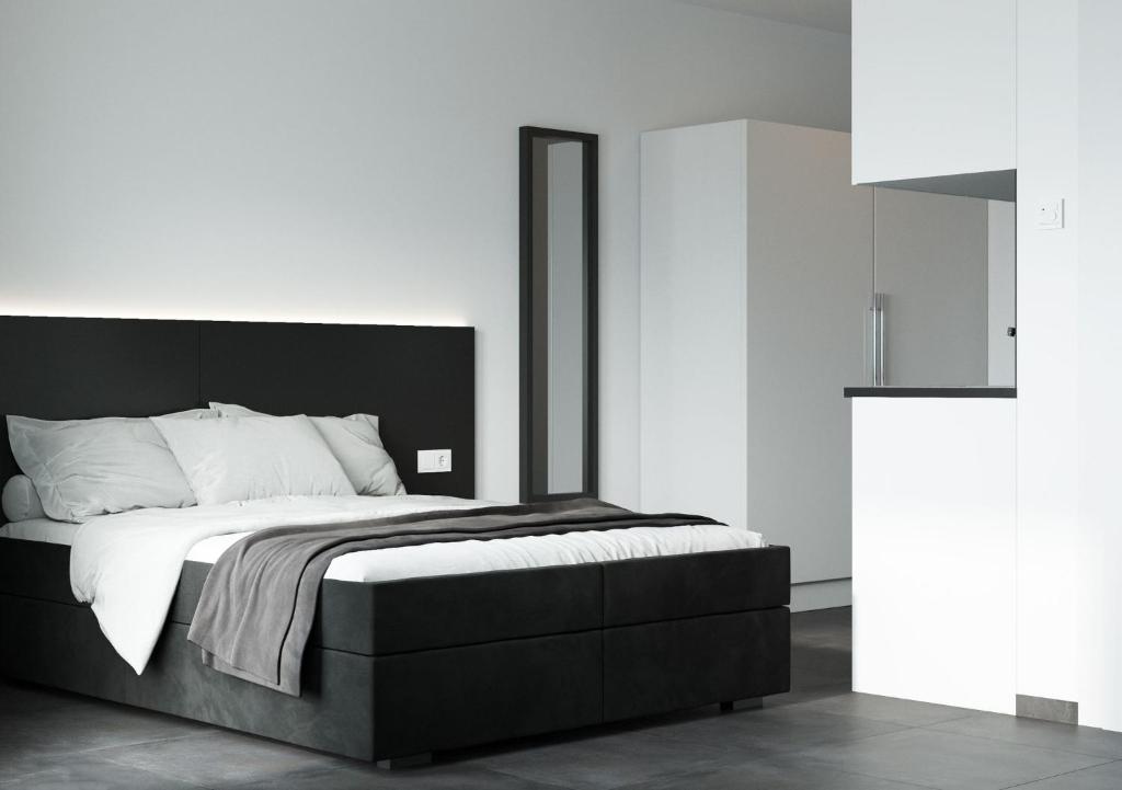 Postel nebo postele na pokoji v ubytování The Residences - Apartments Frankfurt