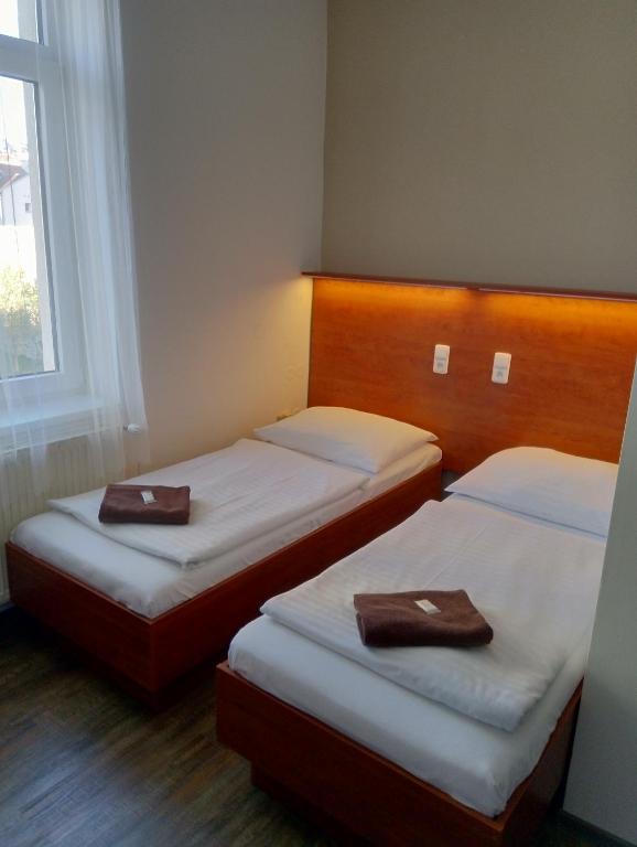 Postel nebo postele na pokoji v ubytování Beta Pension