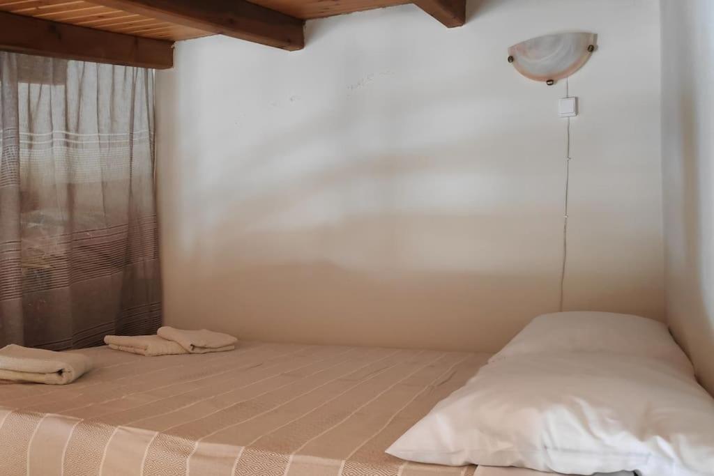Postel nebo postele na pokoji v ubytování Stefanis traditional house - Kampos