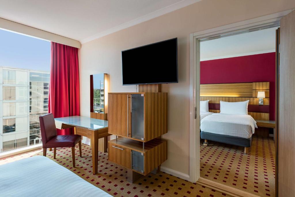 Postel nebo postele na pokoji v ubytování Radisson Blu Hotel London Stansted Airport