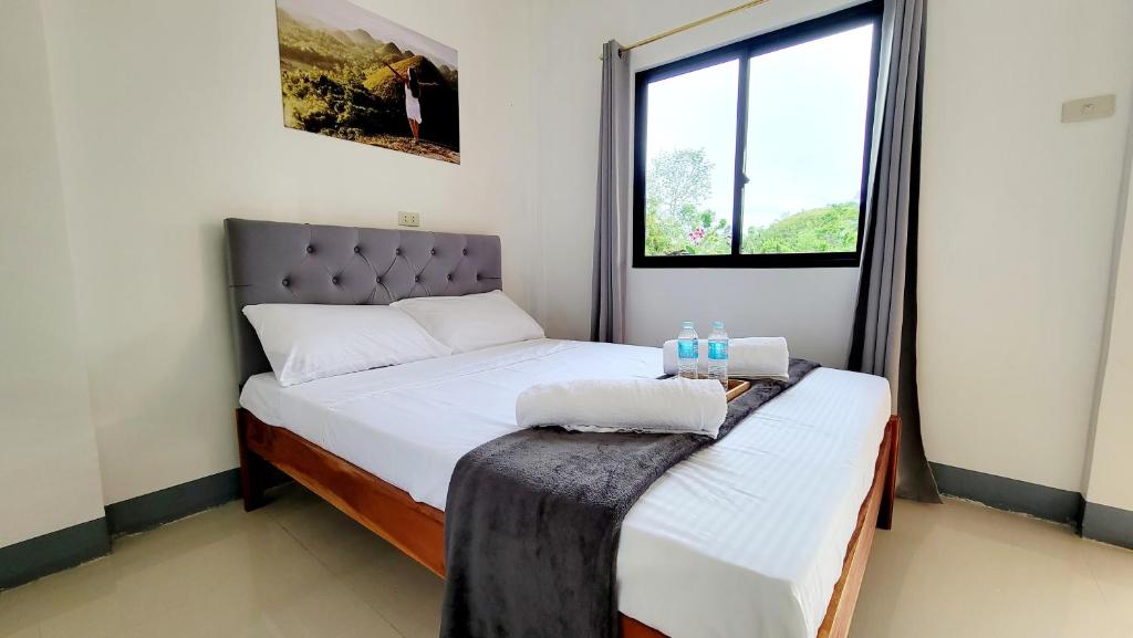 a bedroom with two beds and a window at Matilde B&B - La Paz, Carmen in Carmen