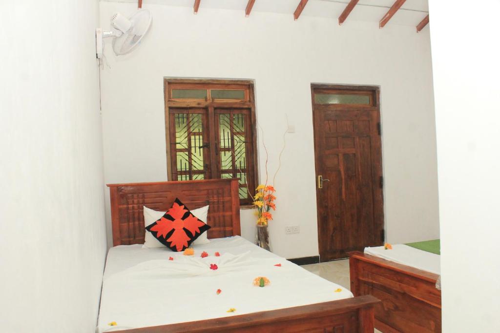 Postel nebo postele na pokoji v ubytování Sigiriya Hillside View Villa