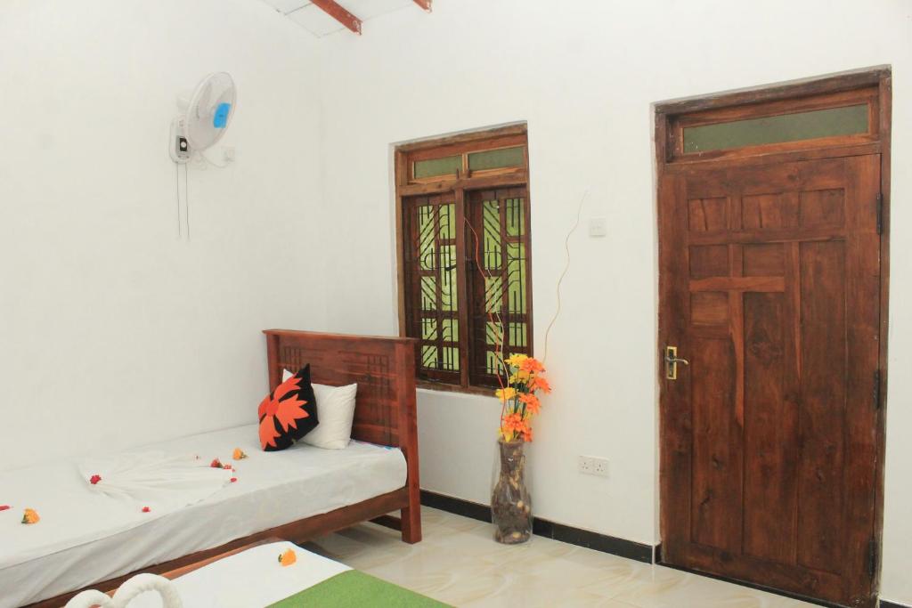 Postel nebo postele na pokoji v ubytování Sigiriya Hillside View Villa